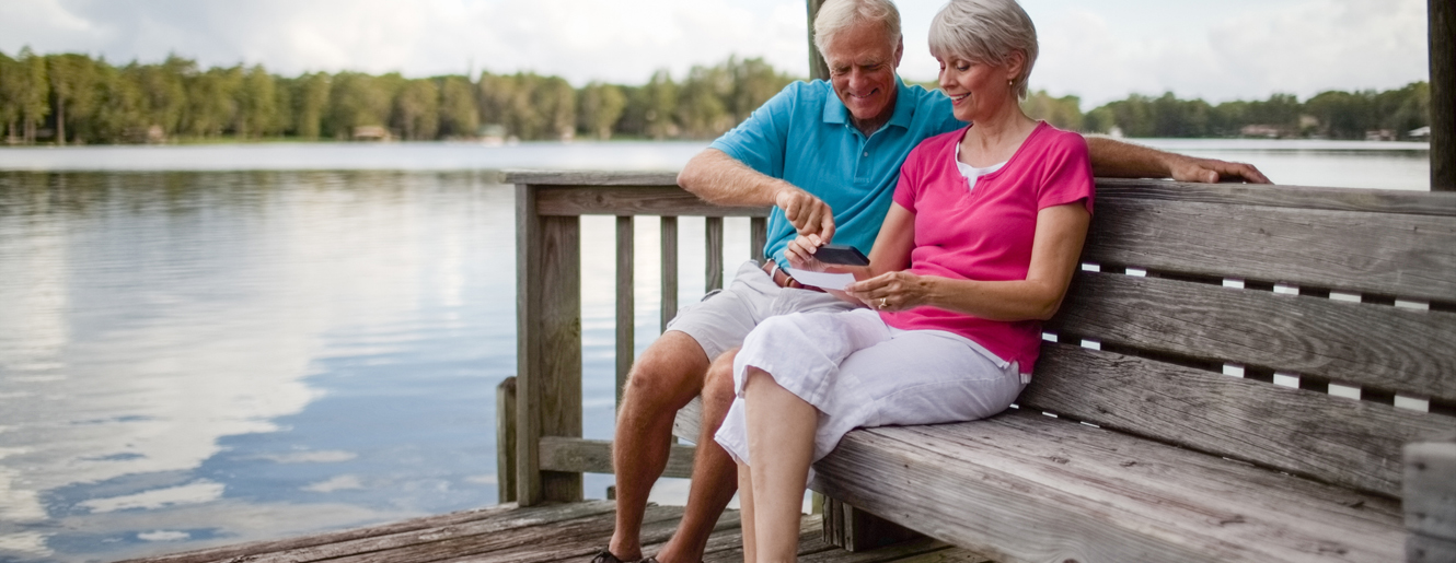 Man and Woman using cell phone.